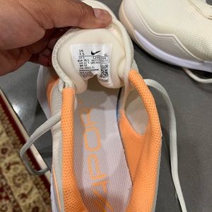 Vapor Pro Nike ladies tennis shoes. Brand new, size 7.5.  orange/white color.